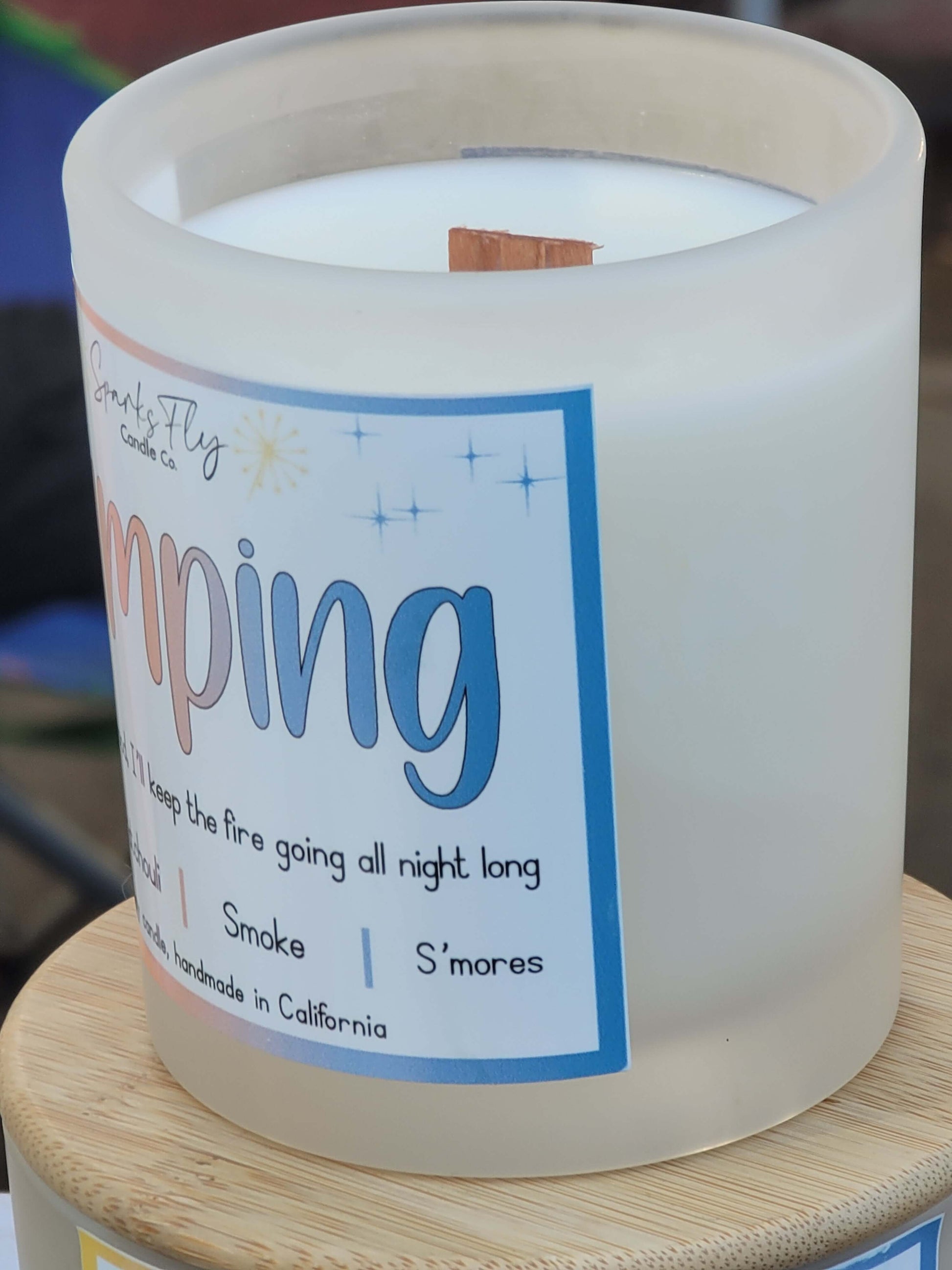 Camping sassy candle; humorous design hinting at campfire warmth and lasting memories