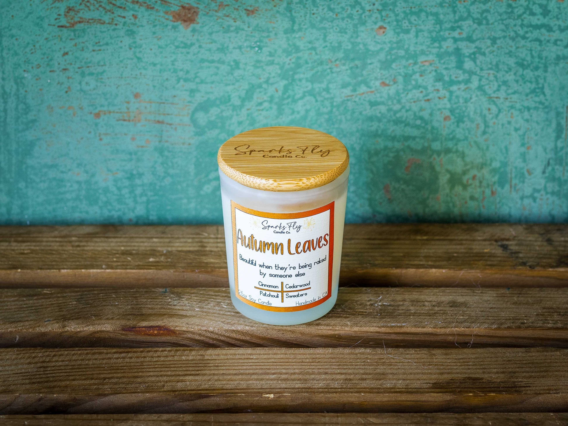 Autumn Leaves sassy candle; celebrates the beauty of fall foliage best enjoyed when raked by others, satire