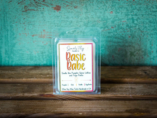 Basic Babe sassy candle; encapsulating the essence of pumpkin spice lattes and the comfort of yoga pants. satire
