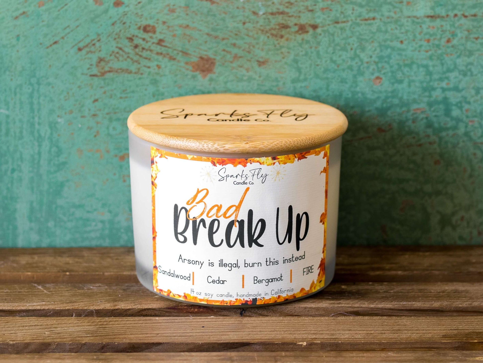 Bad Breakup sassy candle; promoting legal relief from heartbreak with a fiery scent twist, satire