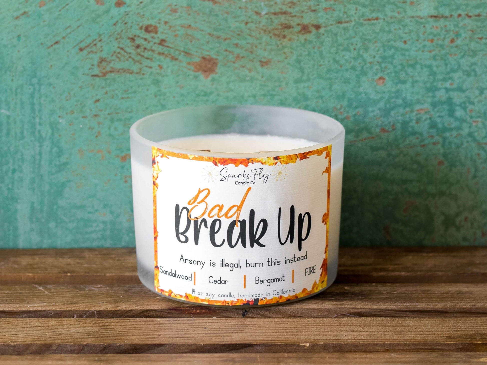 Bad Breakup sassy candle; promoting legal relief from heartbreak with a fiery scent twist, satire