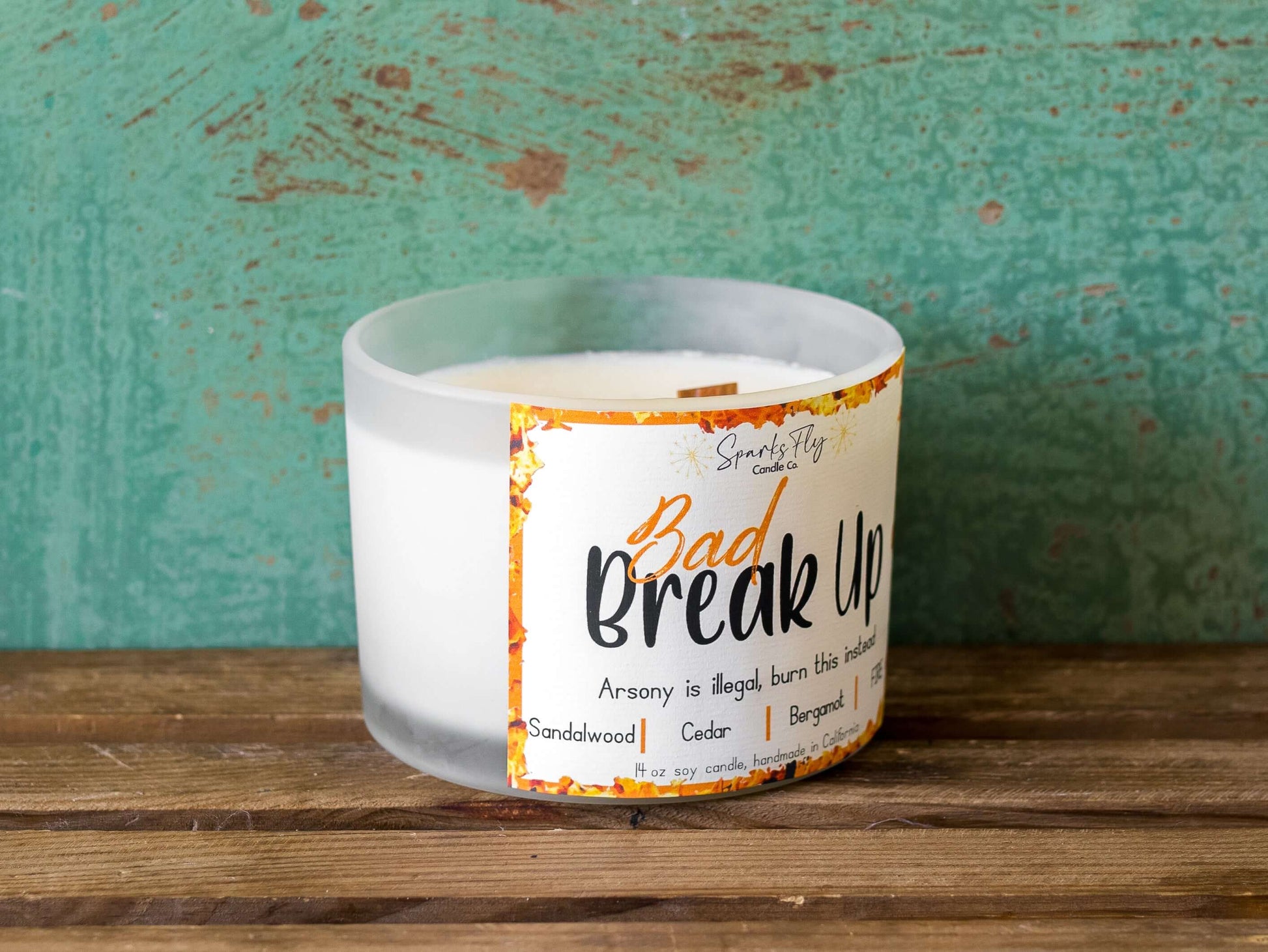 Bad Breakup sassy candle; promoting legal relief from heartbreak with a fiery scent twist, satire