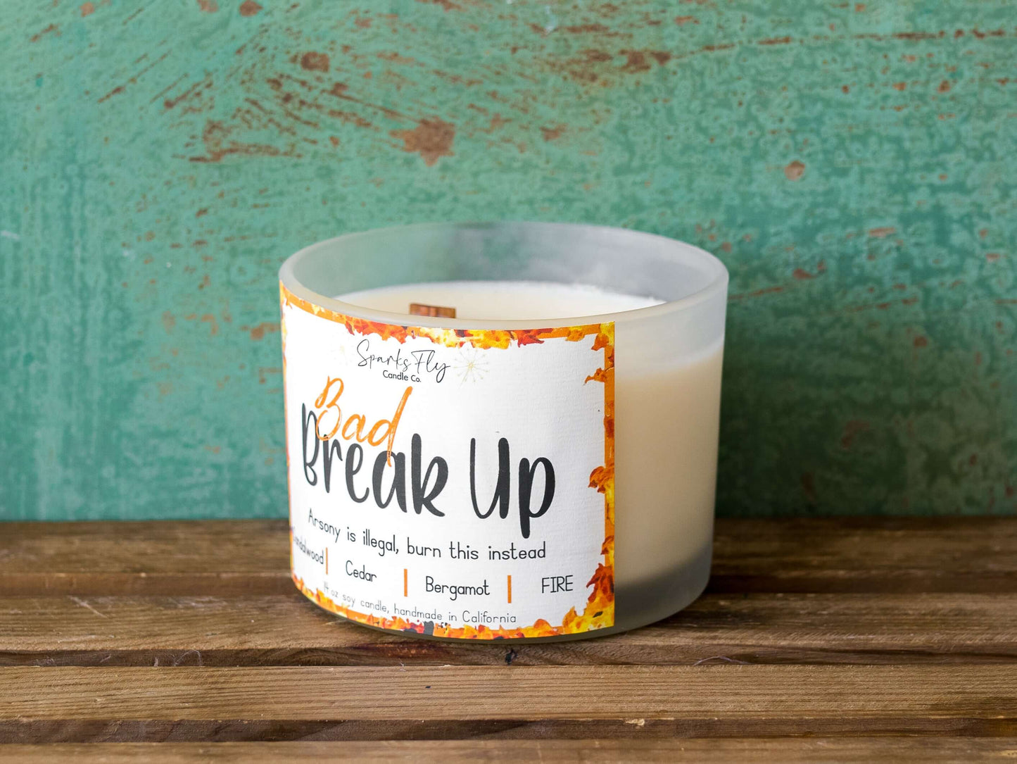Bad Breakup sassy candle; promoting legal relief from heartbreak with a fiery scent twist, satire