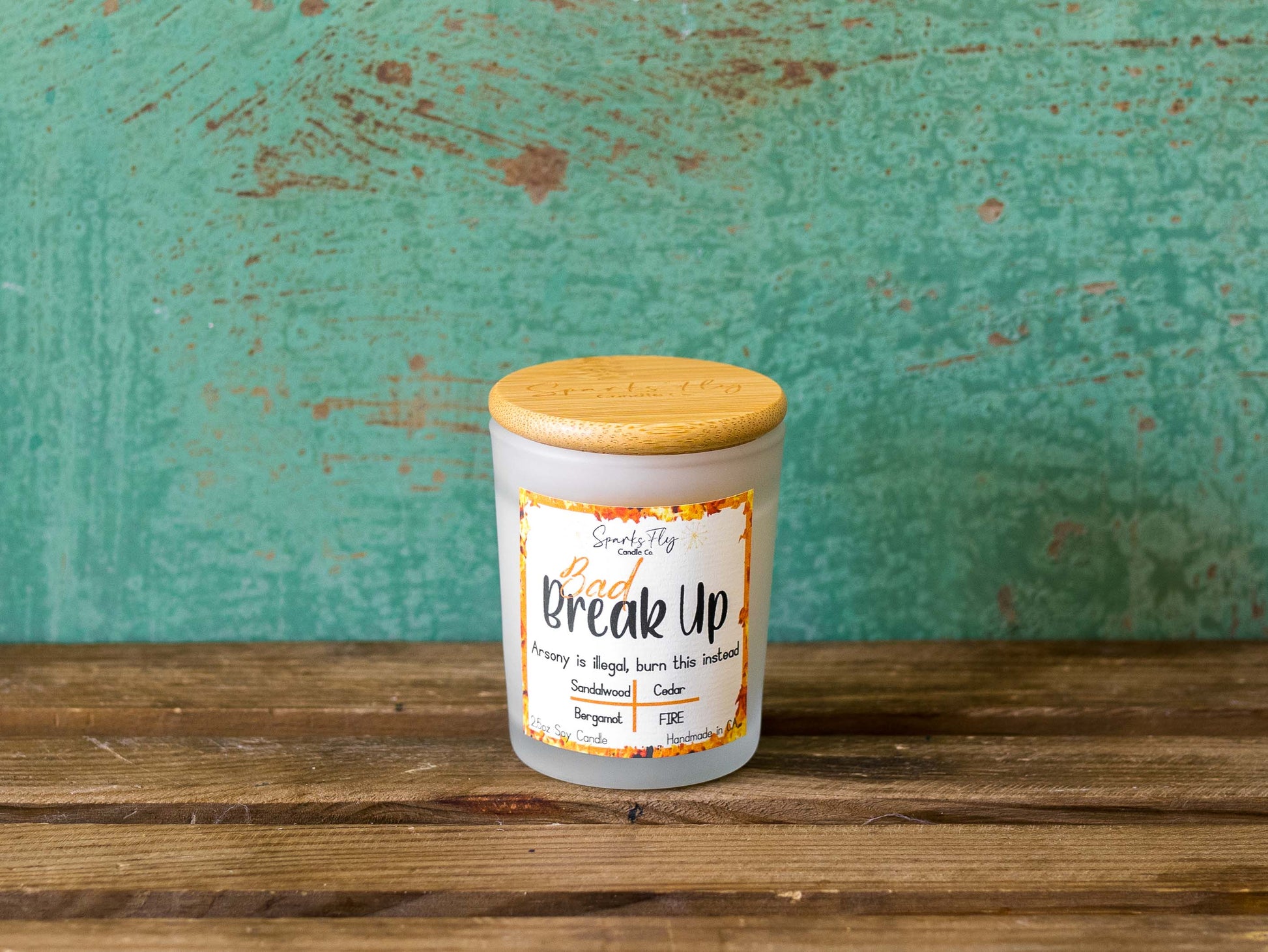 Bad Breakup sassy candle; promoting legal relief from heartbreak with a fiery scent twist, satire