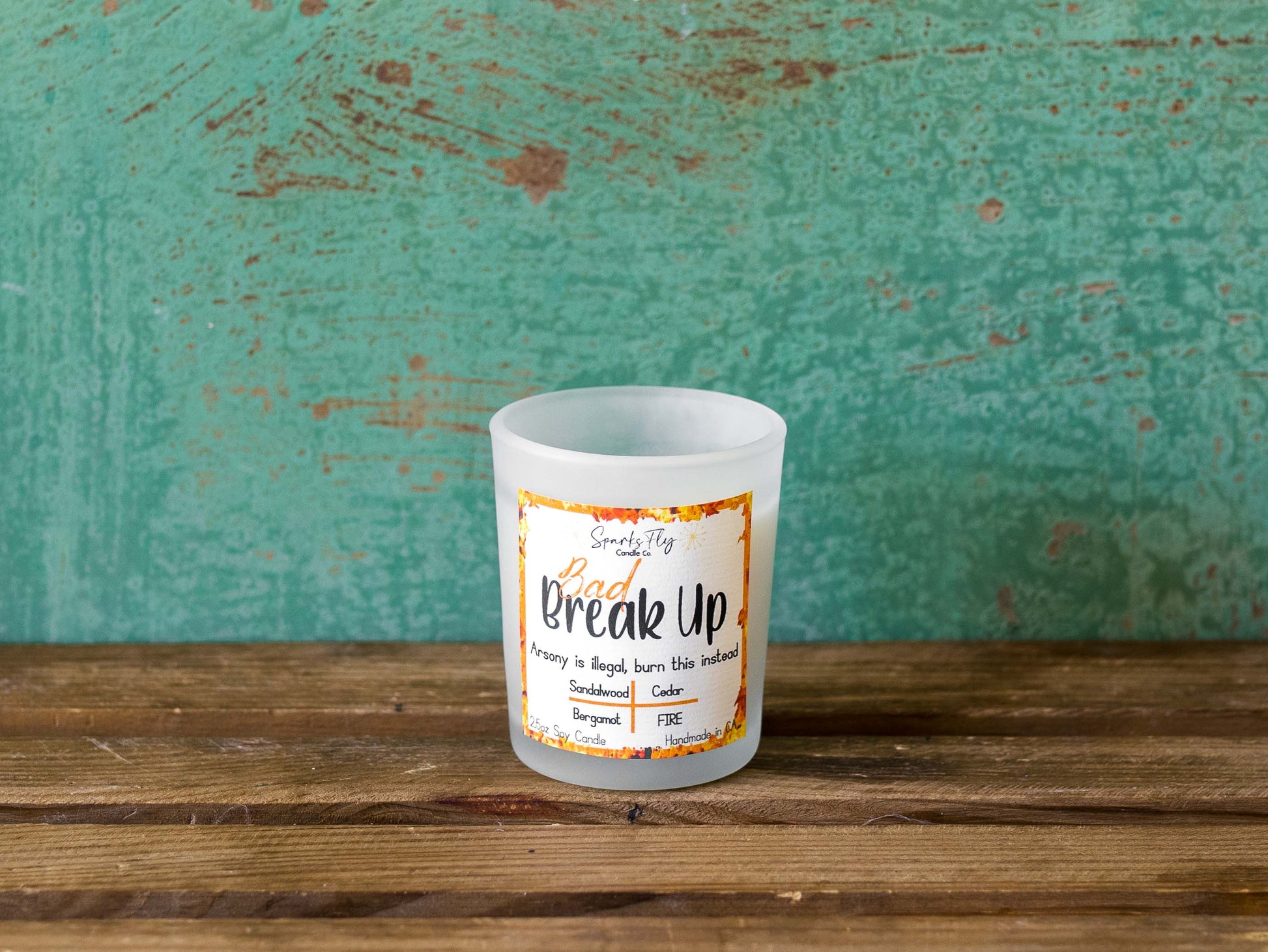 Bad Breakup sassy candle; promoting legal relief from heartbreak with a fiery scent twist, satire