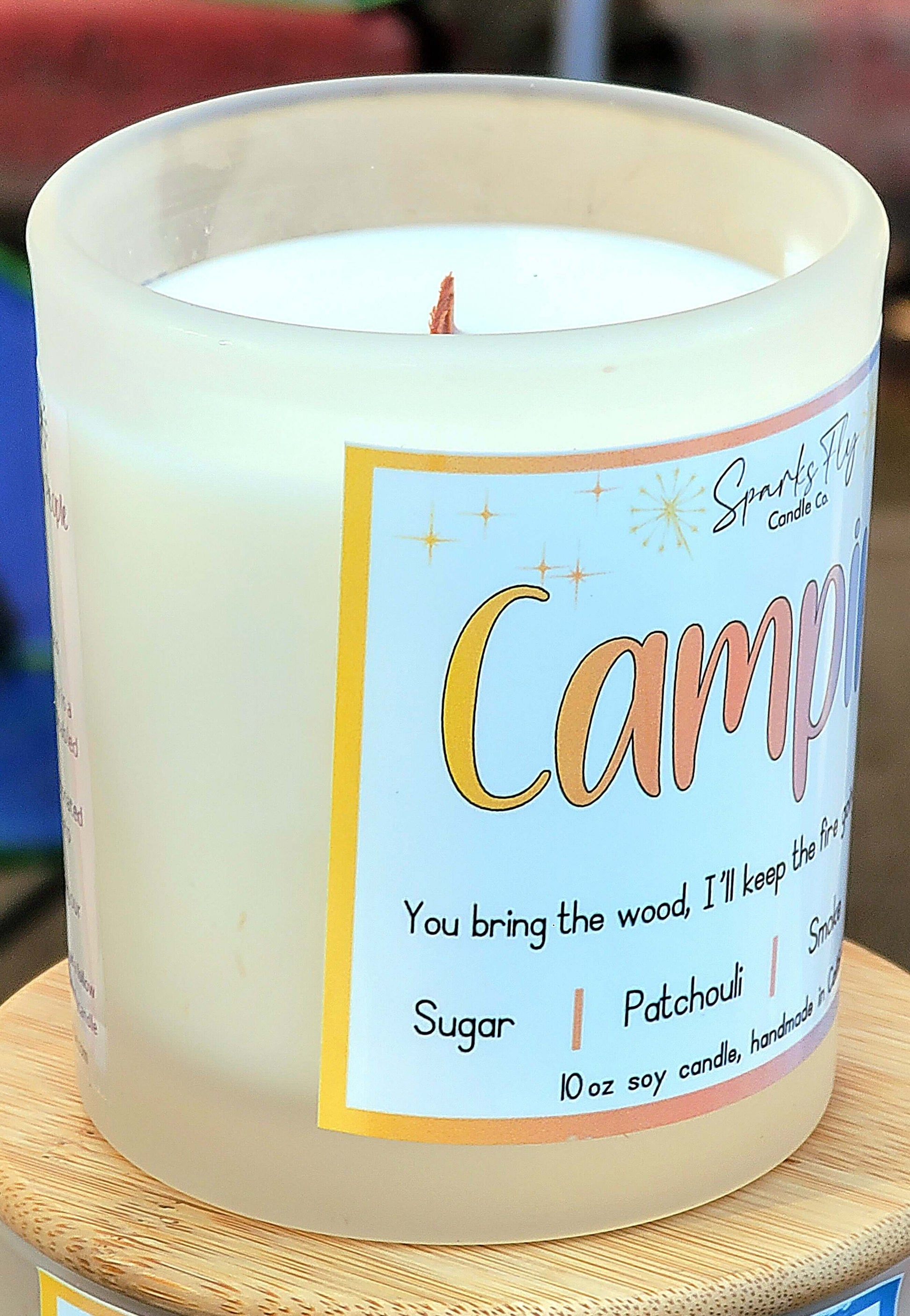 Camping sassy candle; humorous design hinting at campfire warmth and lasting memories