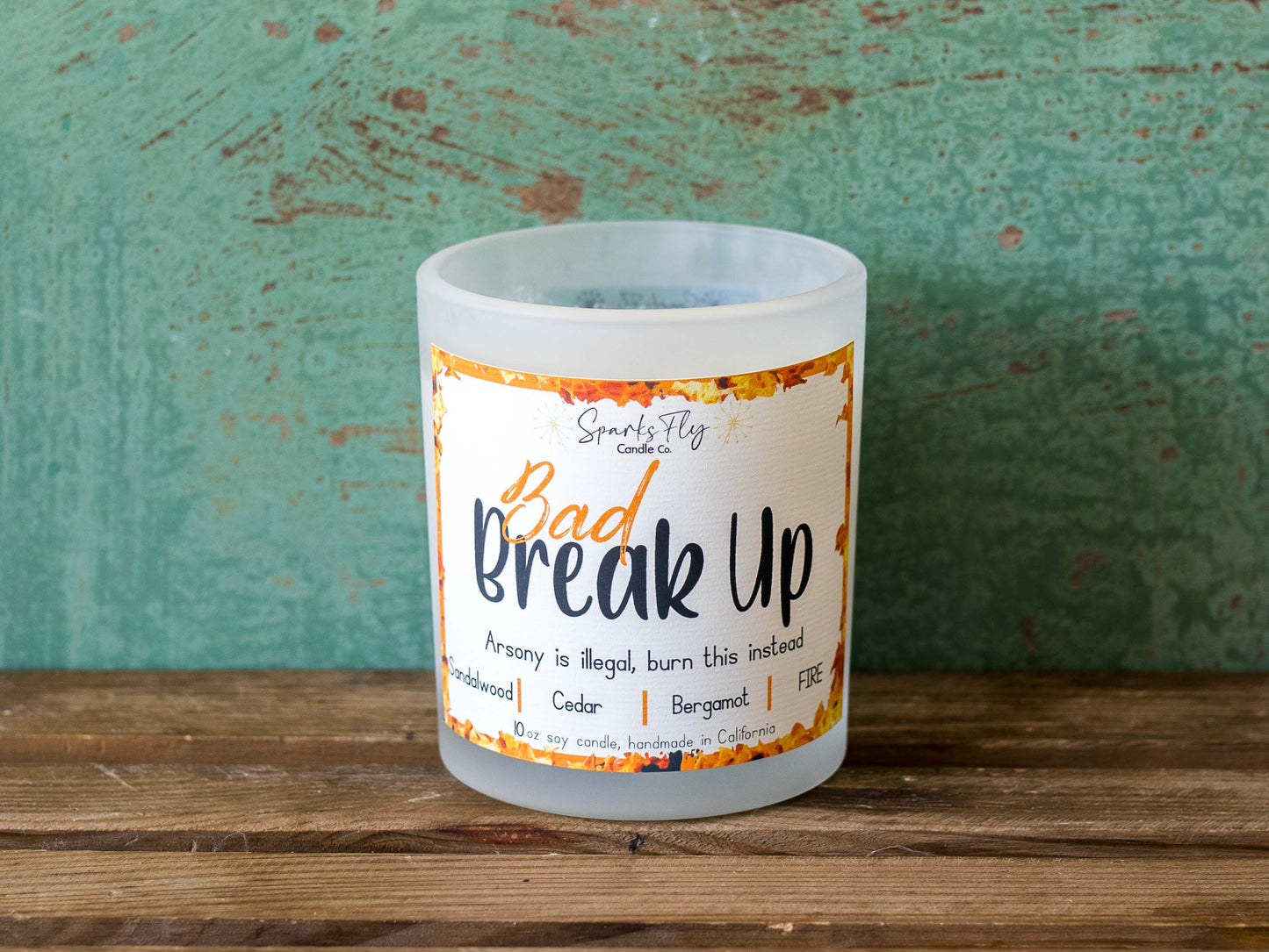 Bad Breakup sassy candle; promoting legal relief from heartbreak with a fiery scent twist, satire