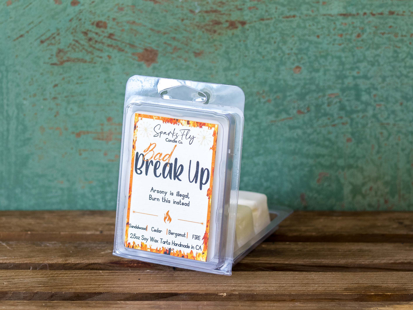 Bad Breakup sassy candle; promoting legal relief from heartbreak with a fiery scent twist, satire