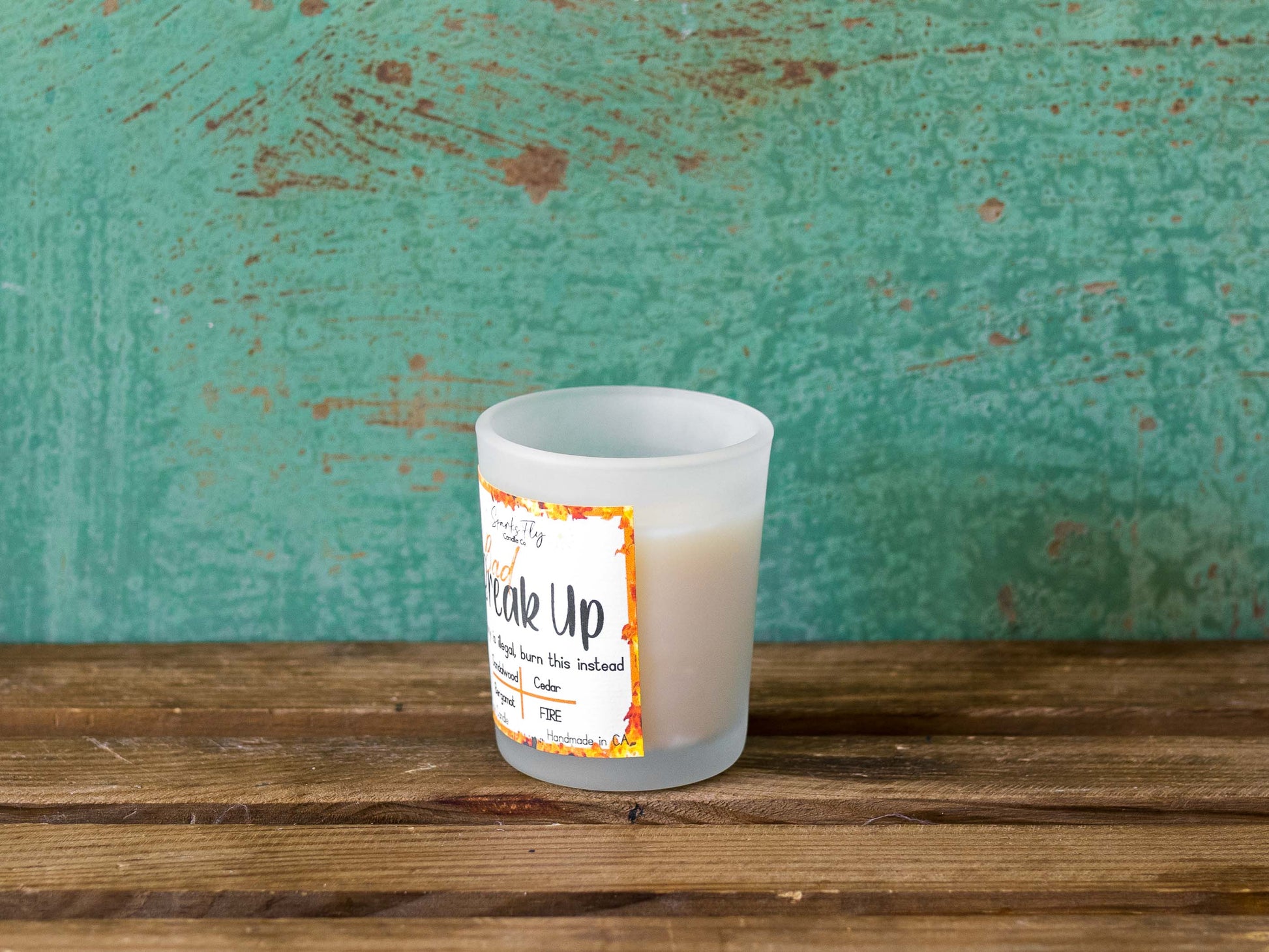 Bad Breakup sassy candle; promoting legal relief from heartbreak with a fiery scent twist, satire