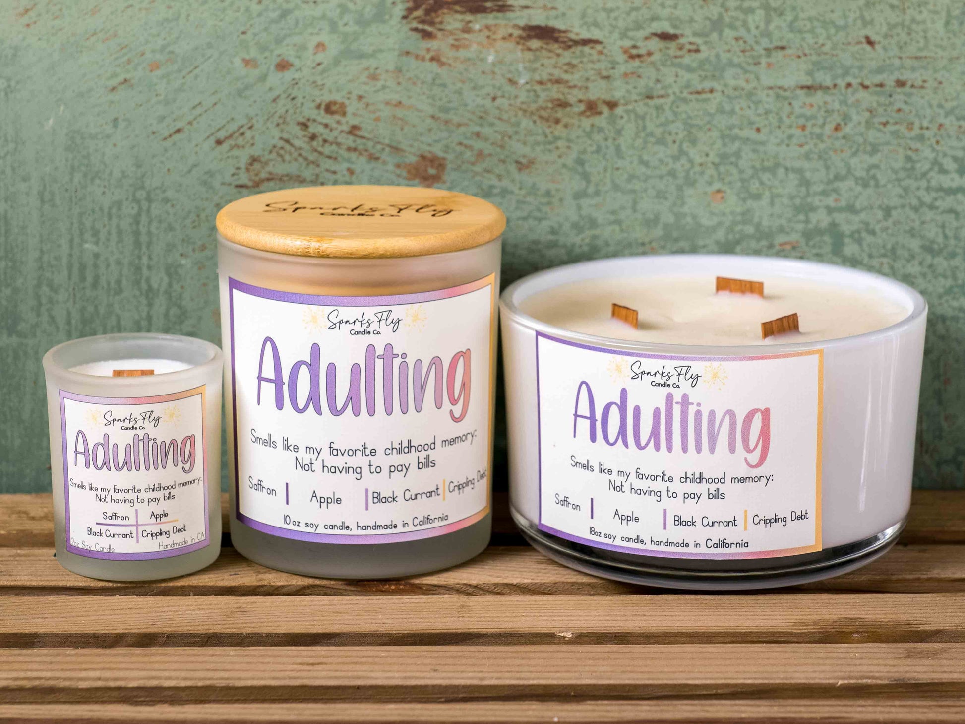 Adulting candle with notes of black currant, absinthe, and apple; capturing childhood memories without bills, satire