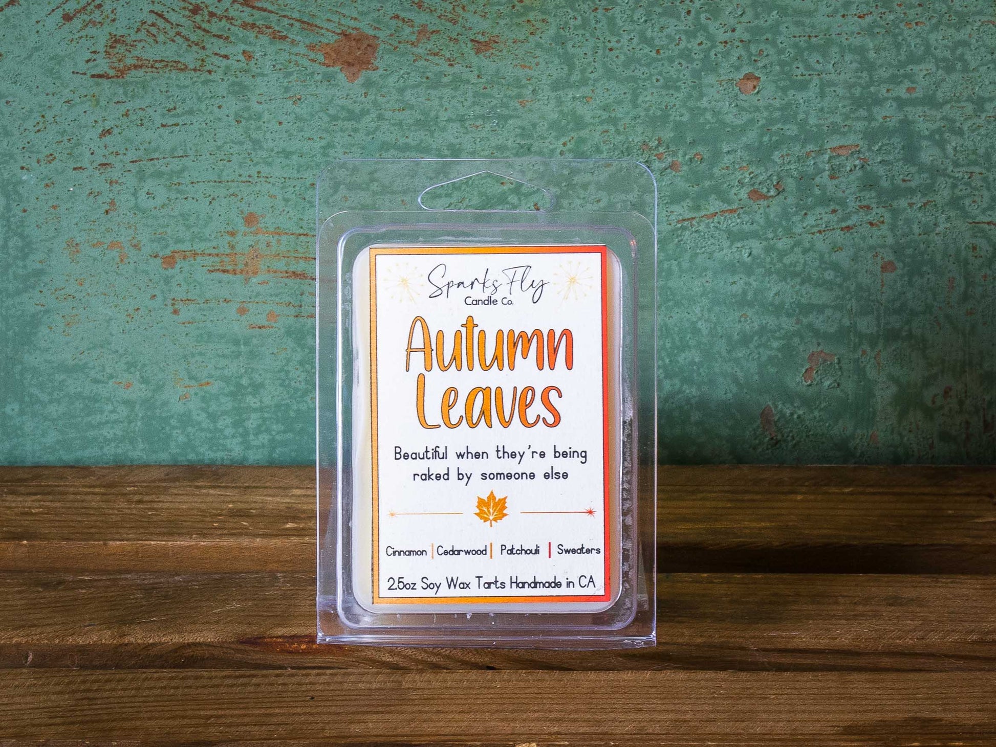 Autumn Leaves sassy candle; celebrates the beauty of fall foliage best enjoyed when raked by others, satire